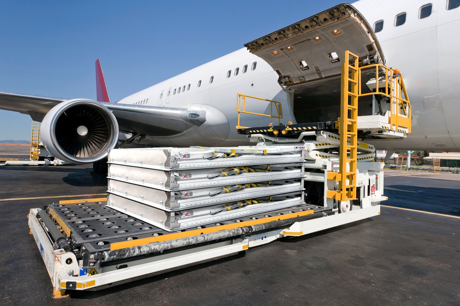 Collapsible containers stacked on a highloader at airport